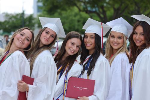 Group of girls in grad cap and gown from Miami Beach Senior High